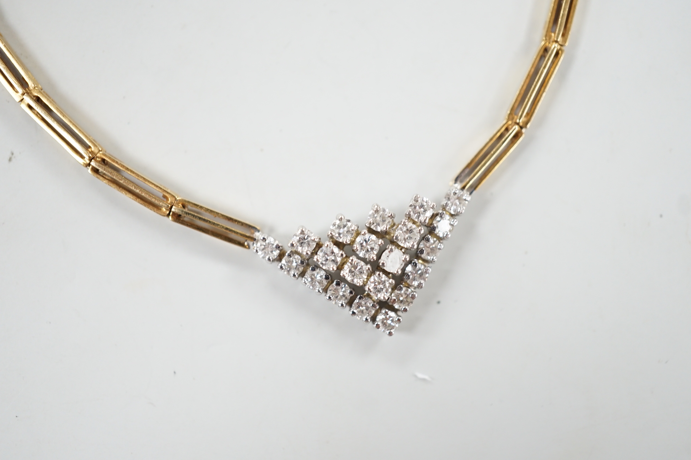 A modern 14kt yellow metal gold diamond cluster set V shaped necklace, approx. 40cm, gross weight 19 grams.